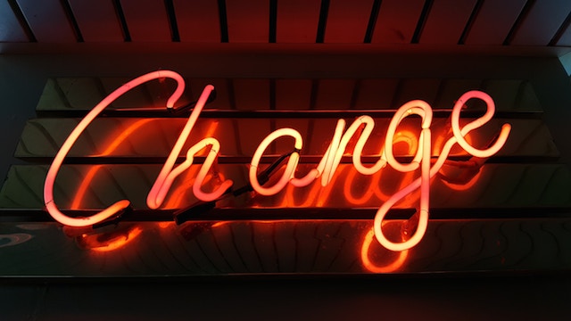 picture of change in neon lights; describing making positive changes in ergonomics Photo by Ross Findon on Unsplash